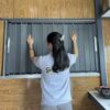 Cửa nhôm xếp che nắng mưa cửa sổ